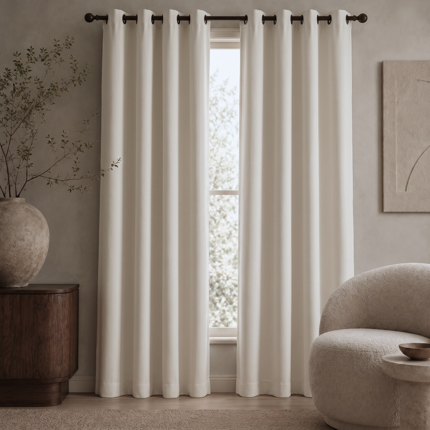 Linen-Look Blackout Curtain in Soft Ivory, hanging in a styled room